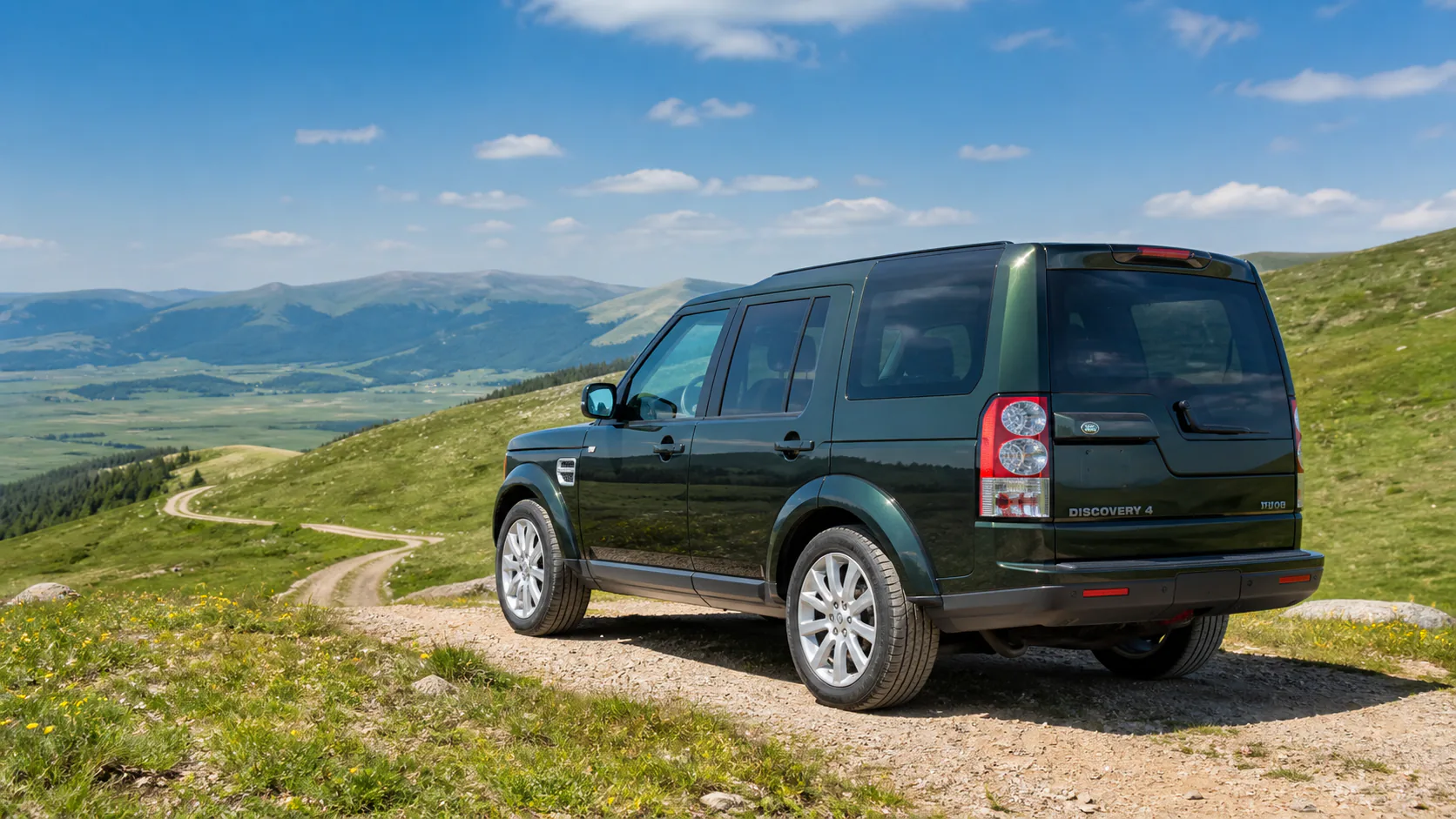 Range Rover driving through hills